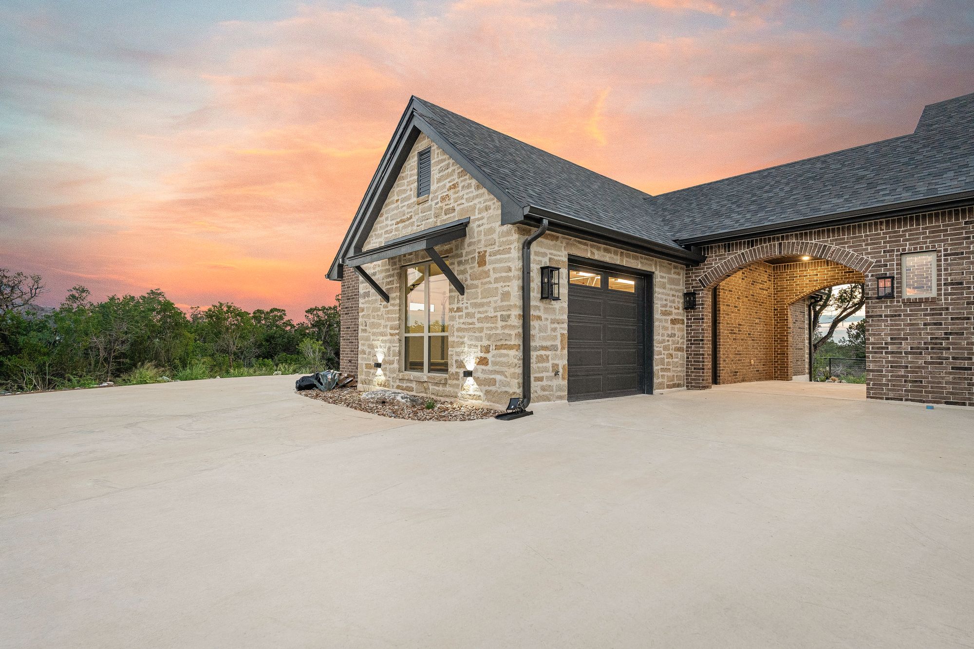 Side elevation with garages at sunset