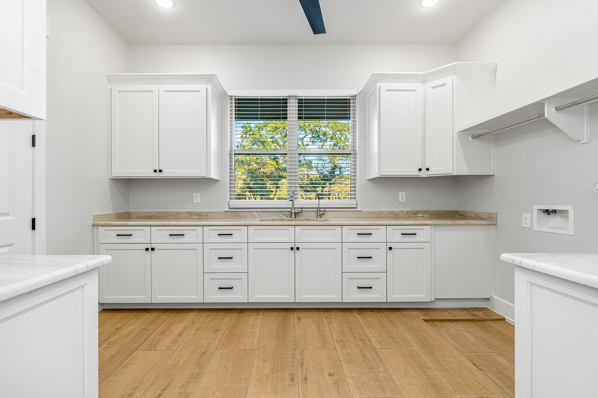 Butler's pantry with sink and prep counter