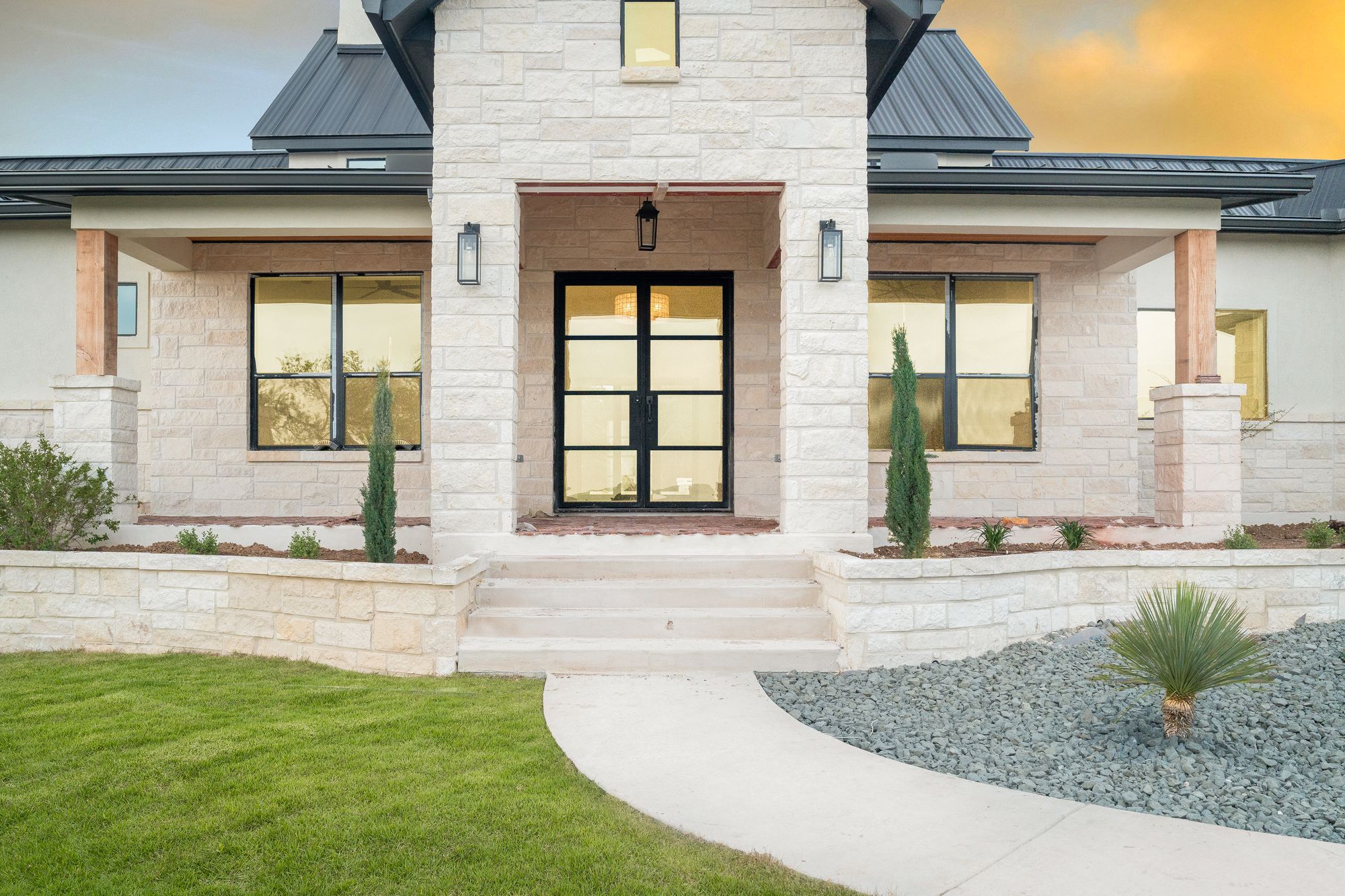 Custom entry elevation lit at dusk