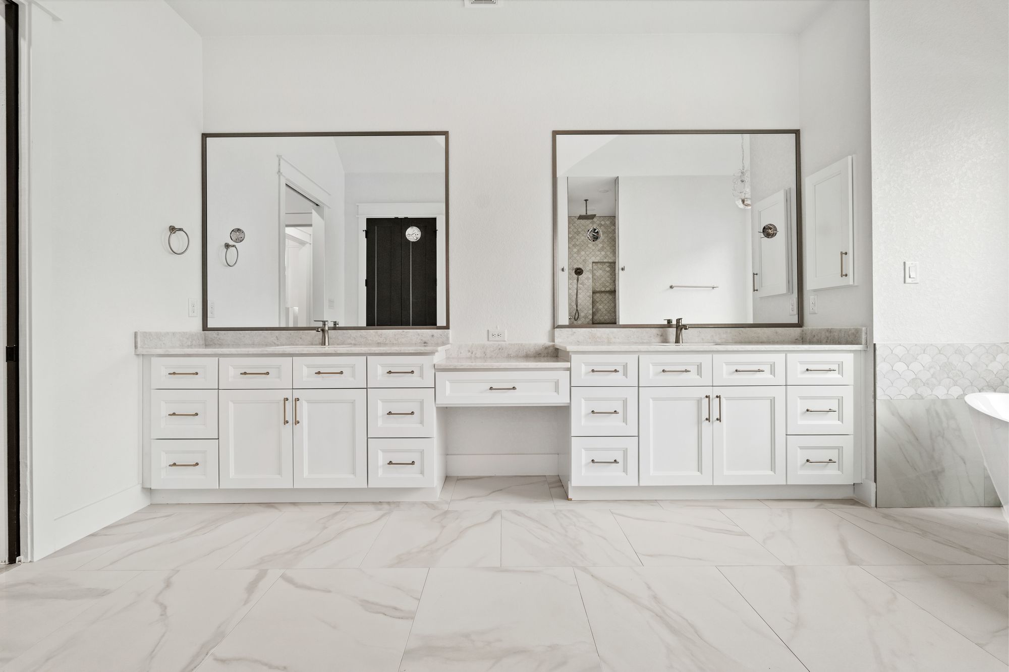 Primary bath with dual vanity and marble floor