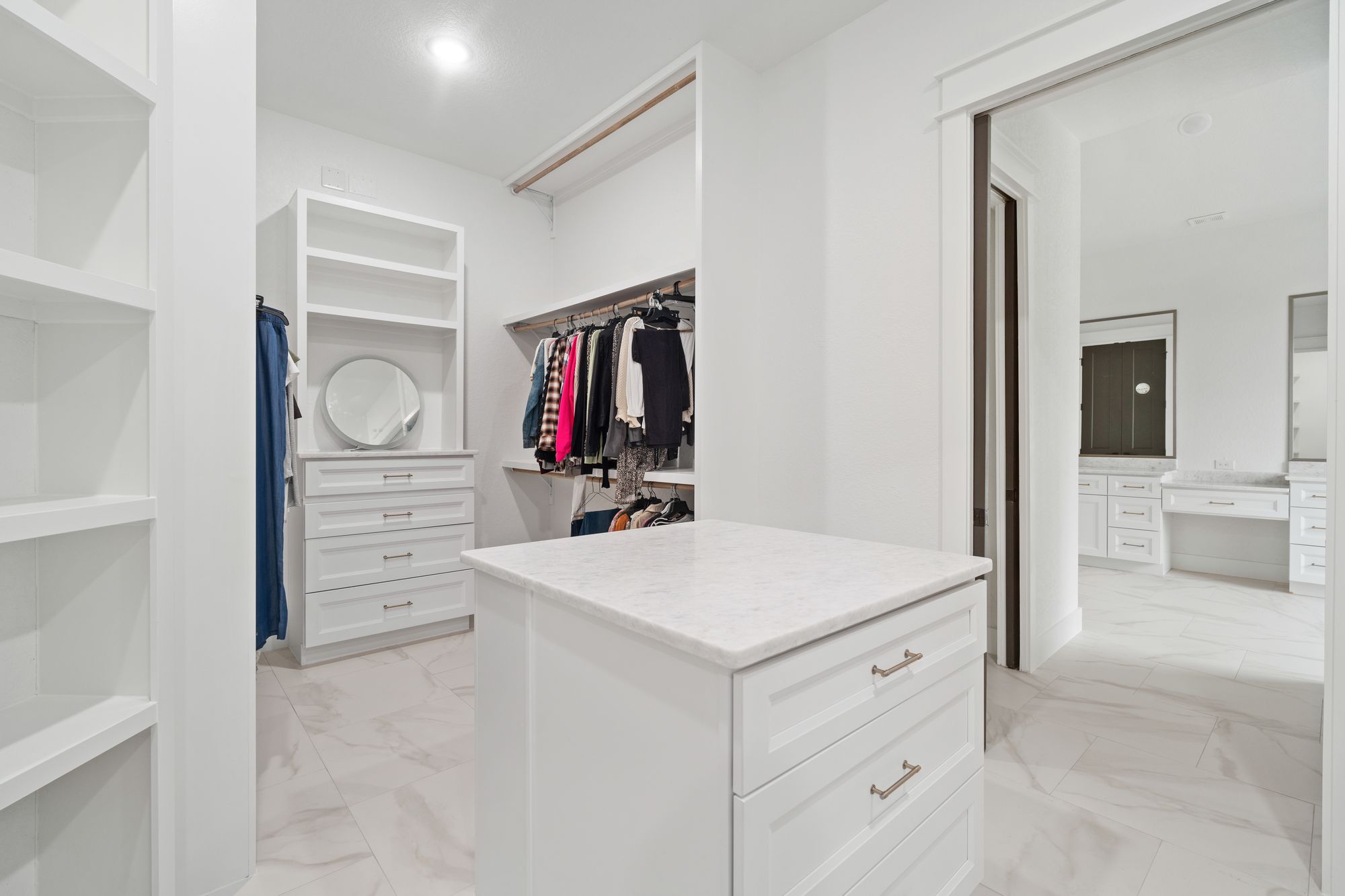 Closet island with drawers and open shelving