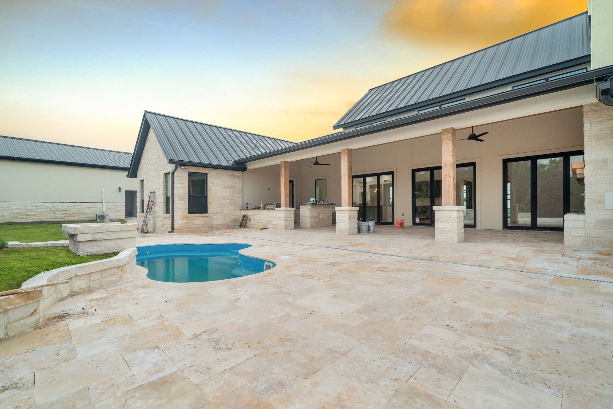 Resort-scale pool terrace with covered living